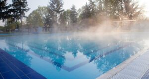Benefits of Pool Heating for A Extended Swimming Seasons shadow